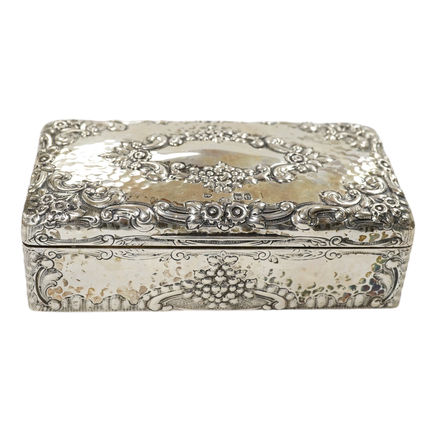 A late Victorian embossed silver rectangular trinket box (converted from a cigarette box), Joseph Braham, London, 1900, 17.5cm. Condition - fair to good